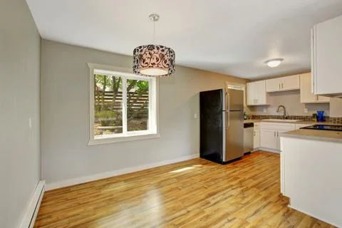 Furnished kitchen room with empty dining area Stock Photos