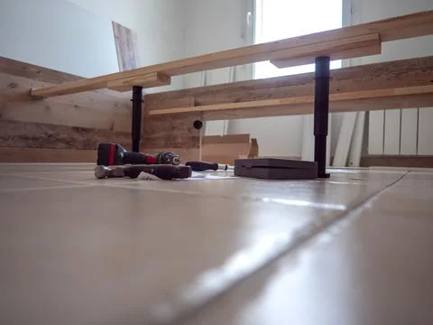 Furniture - assembling the bed, lying tools and wooden elements needed for wo 스톡 사진