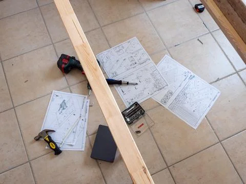 Furniture - assembling the bed, lying tools and wooden elements needed for wo Stock Photos