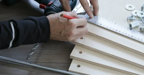 Furniture assembling, drawing marks, close up Stock Footage 145657578