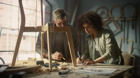 Furniture Designer and Apprentice Working in Studio Video stock 219400205
