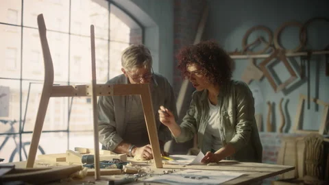 Furniture Designer and Apprentice Working in Studio Video stock 219400327