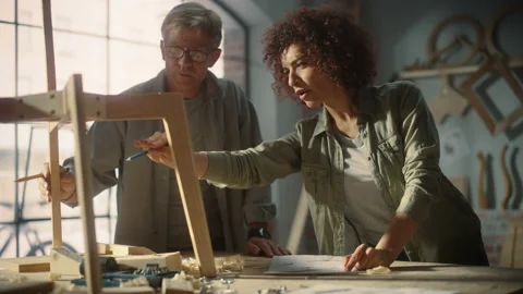 Furniture Designer and Apprentice Working in Studio Video stock 219400492