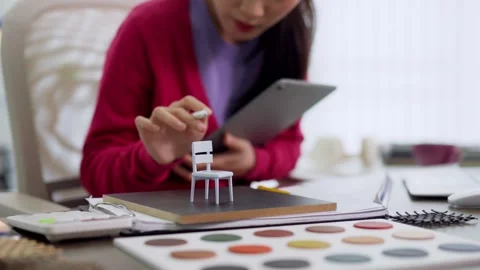 Furniture designer using digital tablet selecting color swatches for miniat.. Stock Footage 336484170