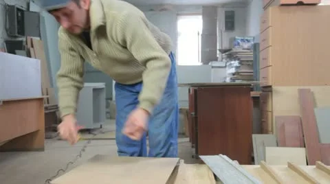 Furniture maker cutting wood panel Stock Footage