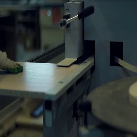 Furniture production wizard makes the processing of the edge of the bar Stock Footage 69520491