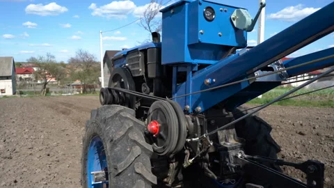 Furrow cutting Two-wheel tractor Video stock 129388693