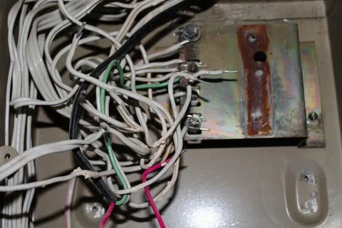 Fuse box in an abandoned building without fuses, only with wires. Wires in th Stock Photos