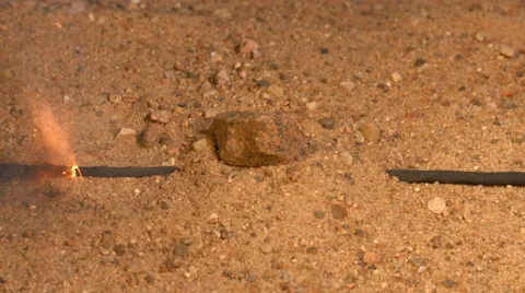 Fuse is burned out under a layer of sand. Blasting 4K video Stock Footage 49784234