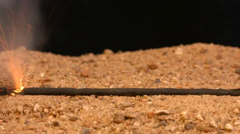 Fuse burns down on the sand in the mine. Dynamite 4k video. Stock Footage 49783148