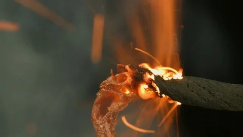 Fuse burns quickly with sparks and smoke on a black background Stock Footage 69905106