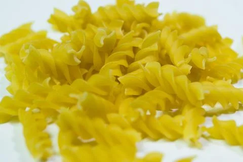 Fusilli dry pasta isolated on white macro view Stock Photos