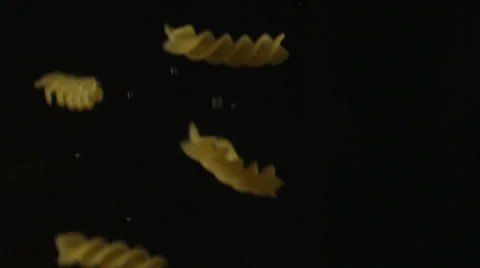 Fusilli falling in water Stock Footage 24896592