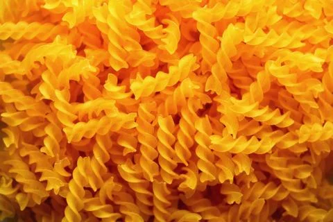 Fusilli noodles background, macaroni texture. Uncooked gluten free pasta from Stock Photos
