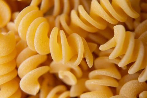 Fusilli pasta background  macro view Stock Photos