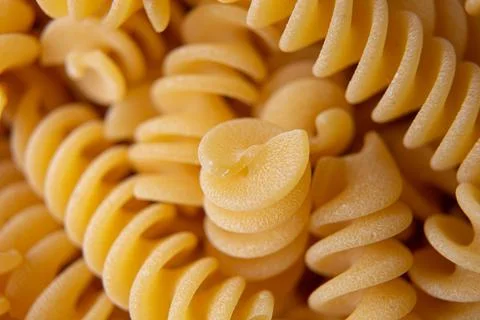 Fusilli pasta background macro view Stock Photos