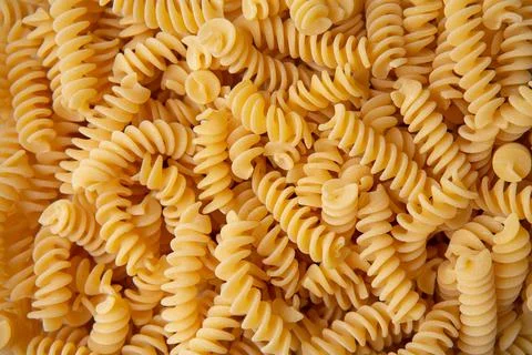 Fusilli pasta background macro view Stock Photos