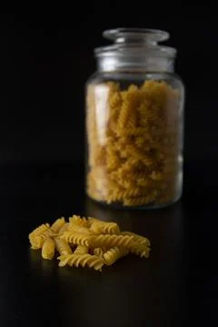 Fusilli pasta on a black background Stock Photos