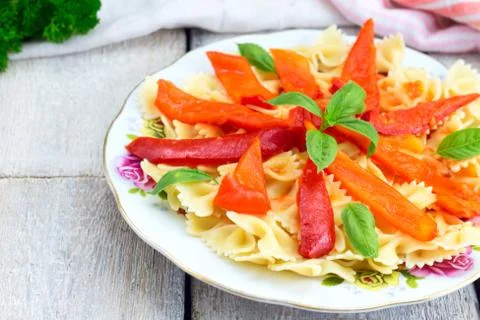 Fusilli pasta with cherry tomatoes, basil and peppers cheese, top view, copy Foto stock