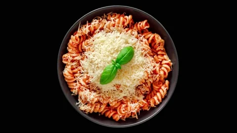 Fusilli pasta, cooked with tomato sauce, grated parmesan and basil, top view 스톡 동영상 207809298