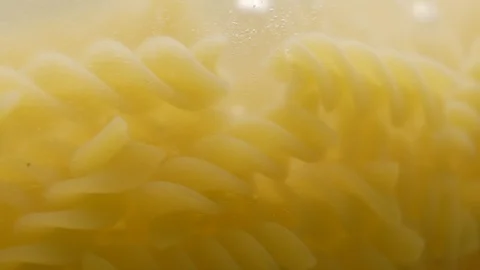 Fusilli pasta cooking boiling in water Stock Footage 108113846