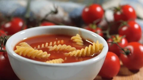 Fusilli pasta dropping in pot with tomato sauce. Italian food pasta concept. Stock Footage 119720057