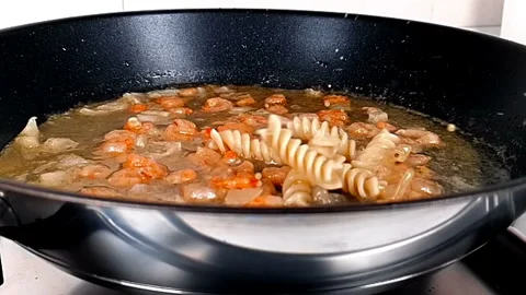 Fusilli pasta onion and shrimp and tomato, falling down Видео 252135743