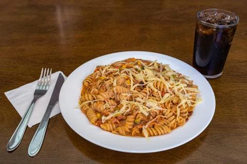 Fusilli pasta served on white plate still life Foto stock
