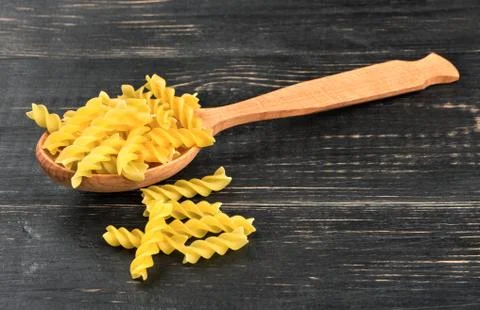 Fusilli pasta in spoon Stock Photos