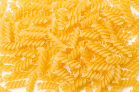 Fusilli pasta on a white background with copy space Stock Photos