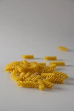 Fusilli pasta on a white background Stock Photos