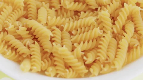 Fusilli pasta in a white plate. 動画素材 165676065