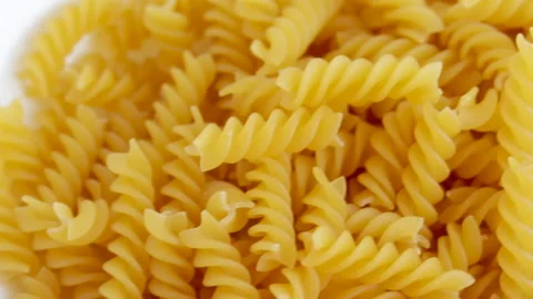 Fusilli pasta in a white plate. Video stock 165676464
