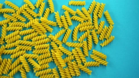 Fusilli spiral paste on a blue background, top view, Stock Footage 133331671