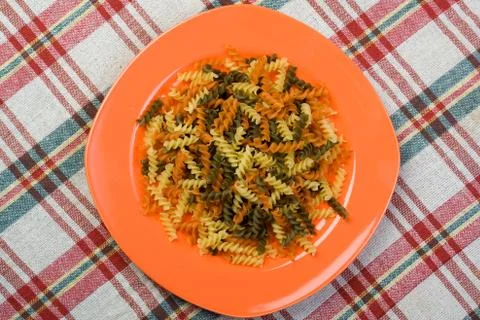 Fusilli on table Stock Photos
