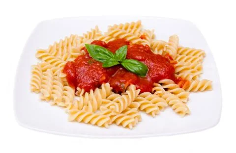 Fusilli with tomato sauce on white background Stock Photos
