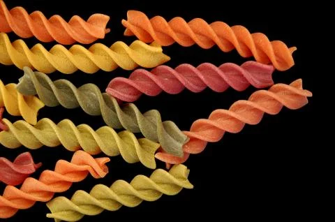 Fusilli twirls pasta background Stock-Fotos