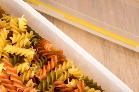 Fusilly in plastic container Stock Photos