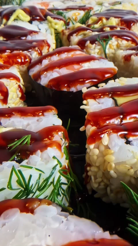 Fusion Sushi Rolls and Gunkan With Teriyaki Sauce Mayo Dill and Raspberries Stock Footage 339078524