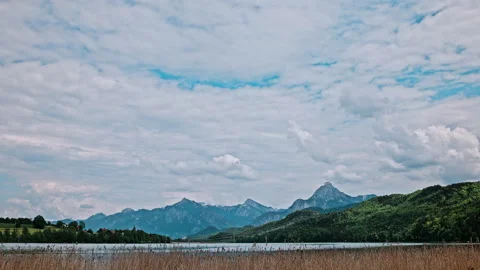 Fussen, Bavaria, Germany - June 03, 2021: Lake scirpus on mountain lake, panning Stock Footage 155257883