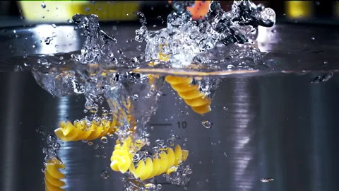 Fussile Pasta Falling Down in to the pot Super Slow Motion 1000fps Video stock 130915879
