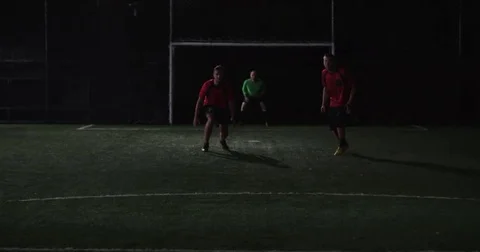 Futbol offense pull off a clever fake out move, but miss the goal. Stock Footage 69213609