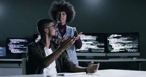 The future is bright. 4k footage of a young male programmer gesturing on a Stock Footage 201112542