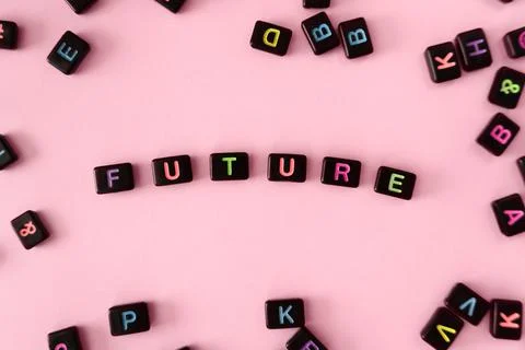 Future button concept. Black beads on pink background making word Stock Photos
