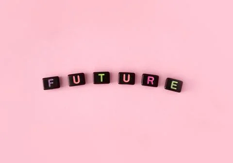Future button concept. Black beads on pink background making word Stock Photos