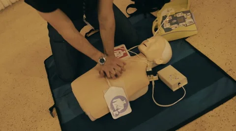 Future doctor trained to provide first aid to the victim Stock Footage 58812464
