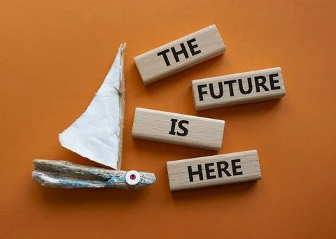 The future is here symbol. Concept words The future is here on wooden block.. Foto stock