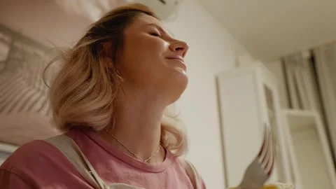 Future mom sticks the fork into cake after smelling it. Stock Footage 302438724