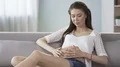 Future mother touching stomach, looking into camera and smiling, clinic advert HD Footage