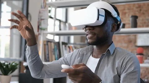 Future is now. Handsome african american man playing game in vr glasses Video stock 116343853